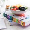 decorating with cookbooks, a stack of cookbooks on a table