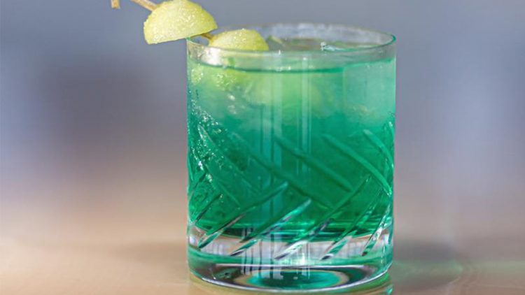 A blue cocktail on the table