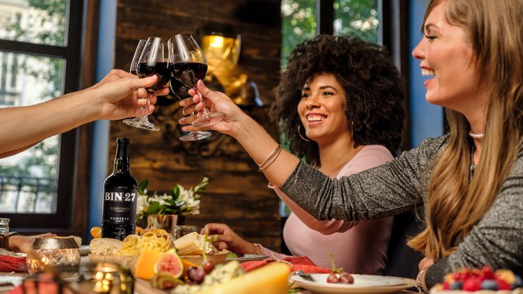 Friends with port wine at a table