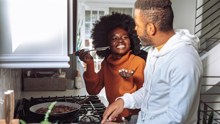 A couple cooking in the kitchen