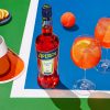 An aperol spritz on a tennis court.